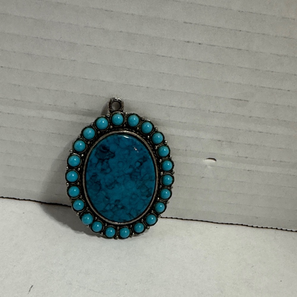 Turquoise Oval Pendant with Silver Accents